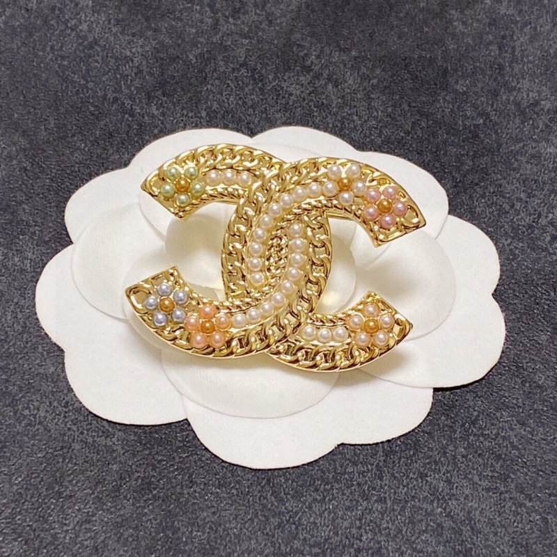 Ch*el brooches